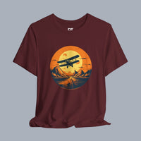 [Biplane graphic flying over mountains at sunset