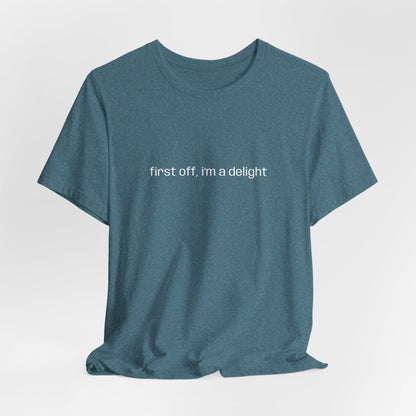 [Ensemble view of teal t-shirt with white text saying "first off, i'm a delight"