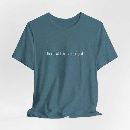 [Ensemble view of teal t-shirt with white text saying "first off, i'm a delight"