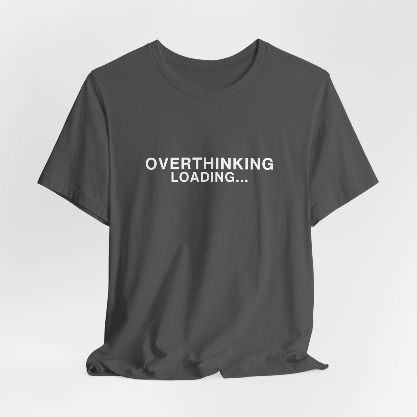 Mockup of a dark gray t-shirt featuring "OVERTHINKING LOADING..."