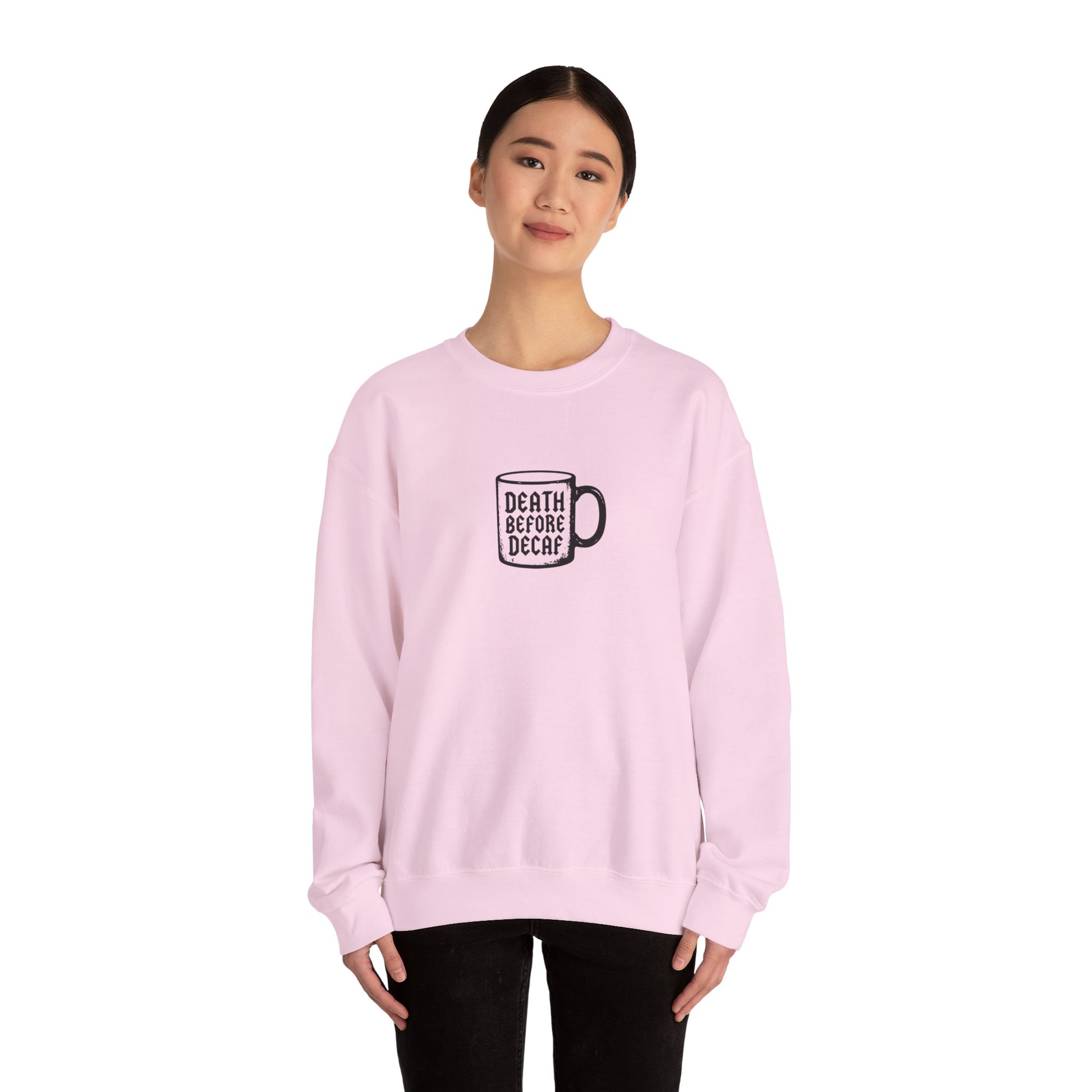 Cream sweatshirt featuring a black graphic of a coffee mug with "Death Before Decaf"]