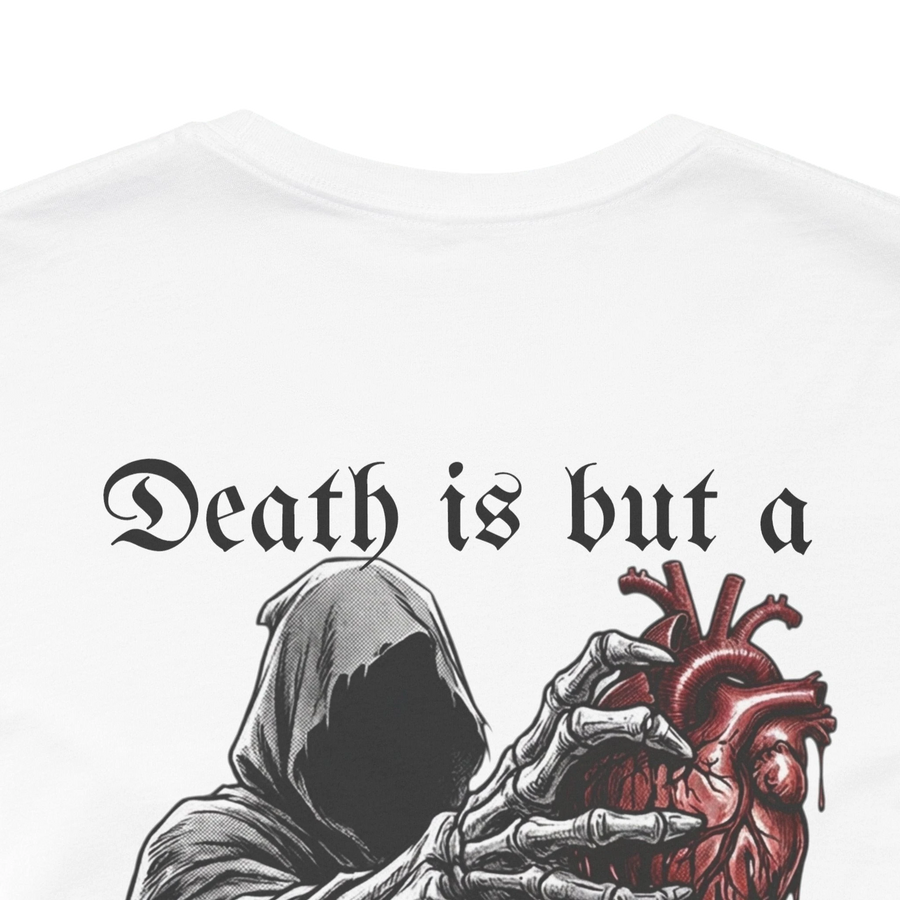 White 100% cotton t-shirt with a graphic of a hooded grim reaper holding a bloody anatomical heart and the text "Death is but a heartbeat away".