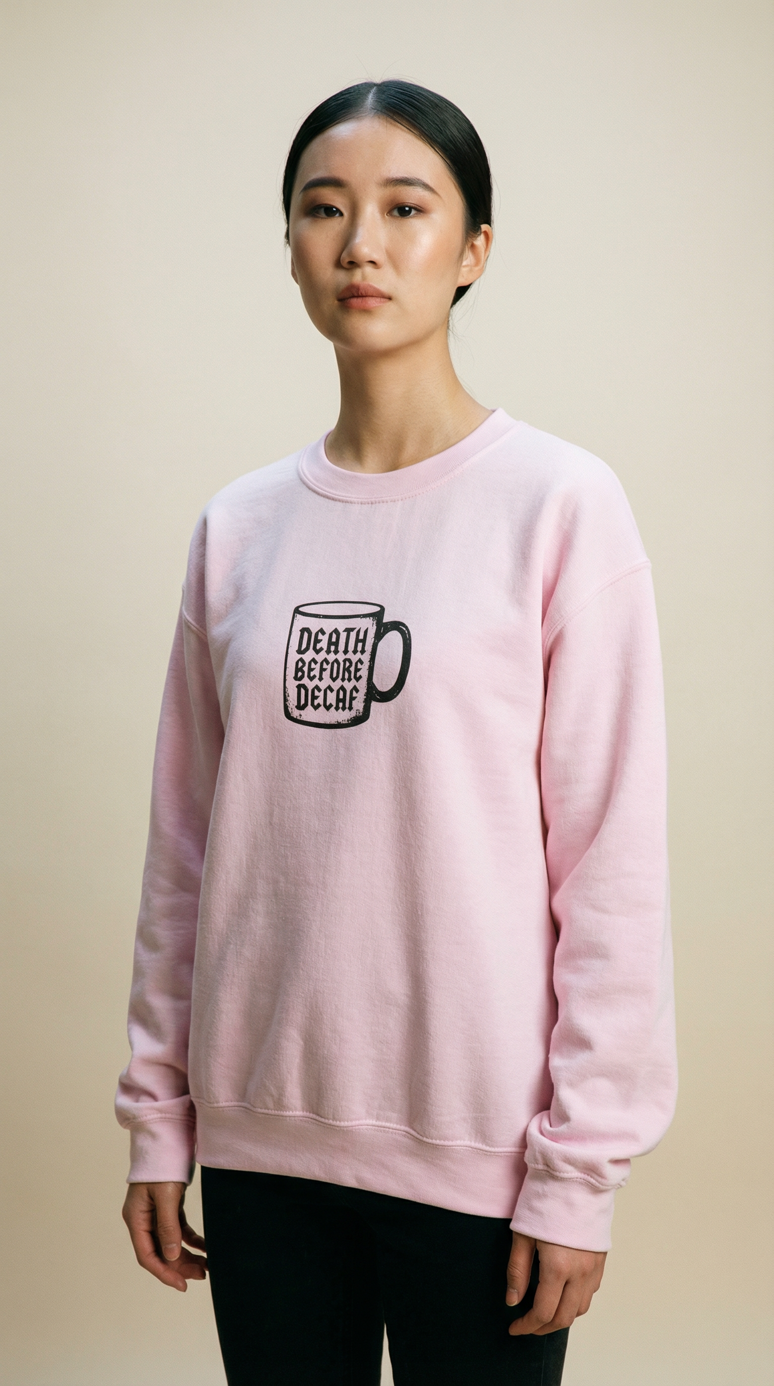 Gray sweatshirt displaying black "Death Before Decaf" mug design