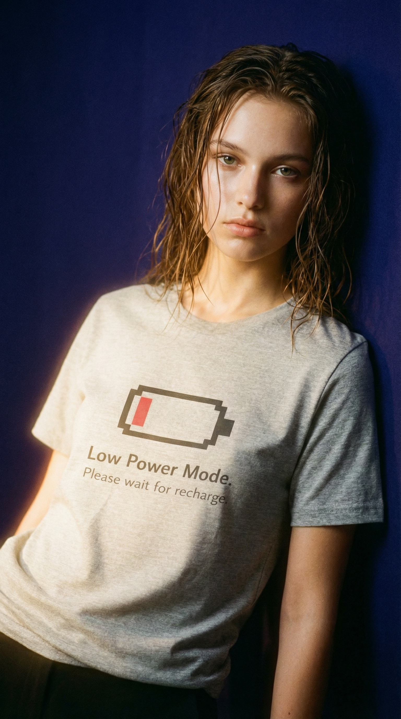 White T-shirt displaying a pixel battery and 'Low Power Mode. Please wait for recharge.'