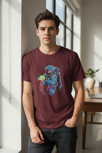 DailyThreadCo. maroon 100% cotton t-shirt with a graphic of an astronaut holding a colorful nebula jellyfish.