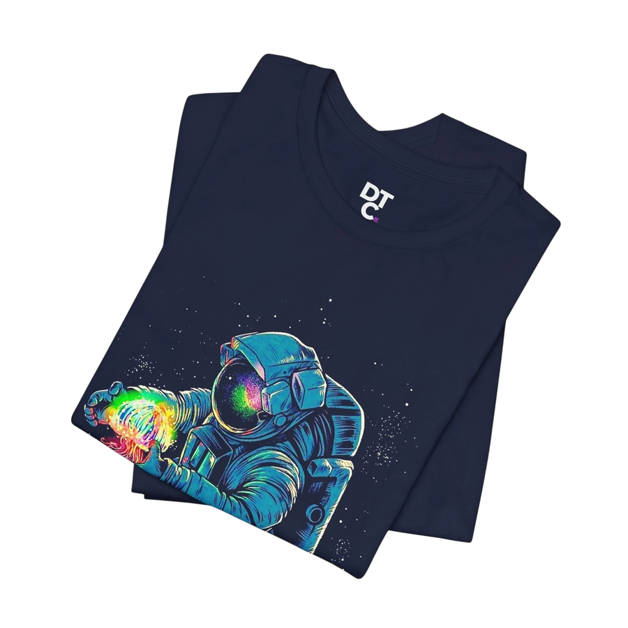 DailyThreadCo. navy blue 100% cotton t-shirt with a graphic of an astronaut holding a rainbow nebula.
