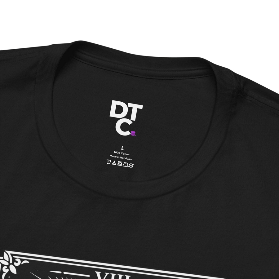 DailyThreadCo. black 100% cotton crew neck t-shirt with vintage Strength tarot card illustration of a woman and lion.