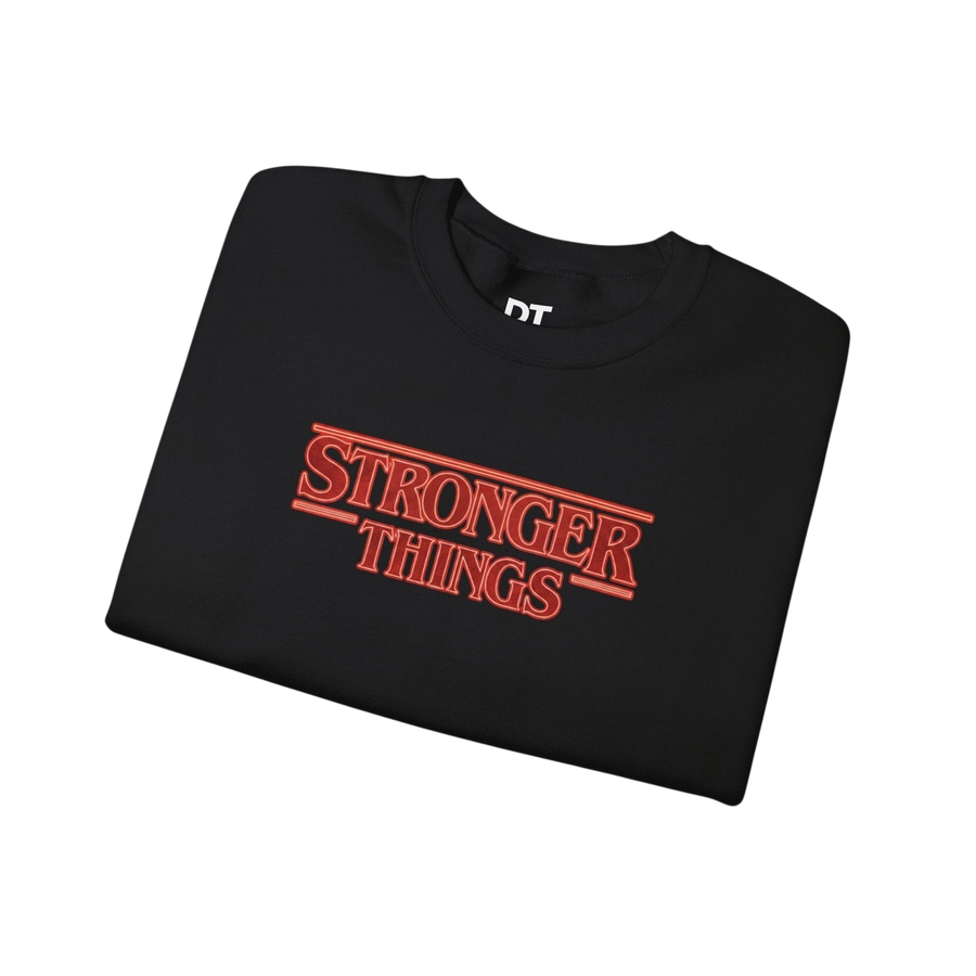 DailyThreadCo. black crewneck sweatshirt with red retro 'Stronger Things' logo embroidery. 50/50 cotton-polyester blend.
