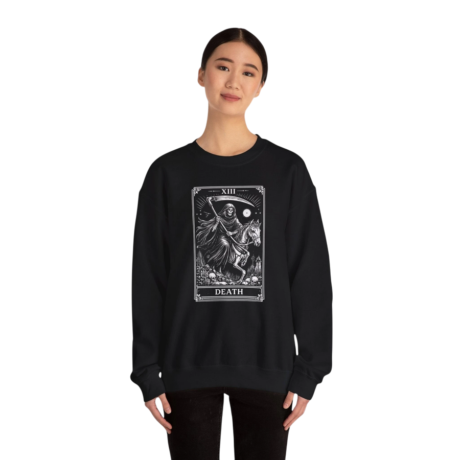 DailyThreadCo. black crewneck sweatshirt with a white Death tarot card illustration featuring a skeletal reaper on a horse, gothic style, medium-heavy cotton-poly blend.
