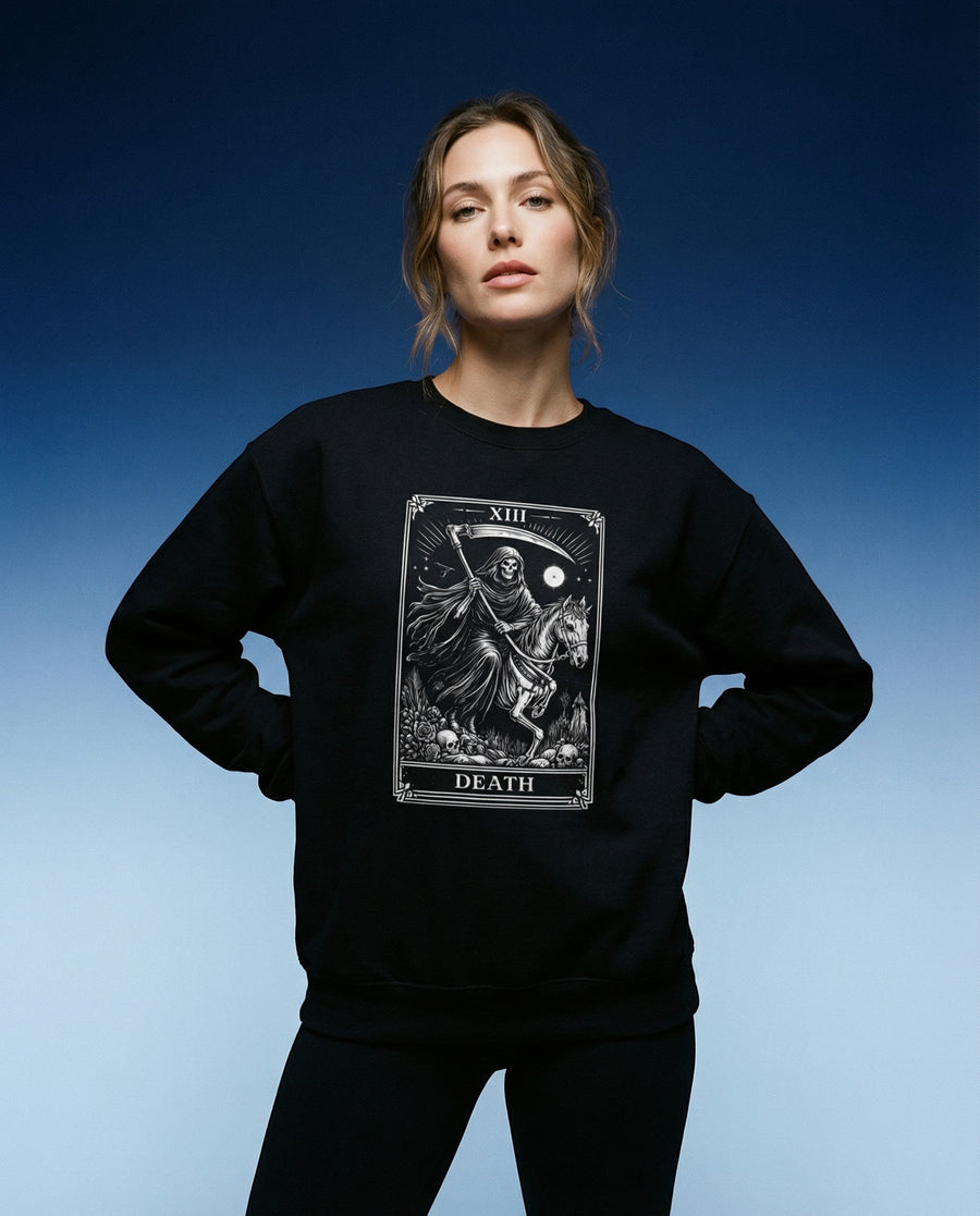 DailyThreadCo. black crewneck sweatshirt with a white Death tarot card graphic featuring a skeleton reaper on a horse. Gothic style.