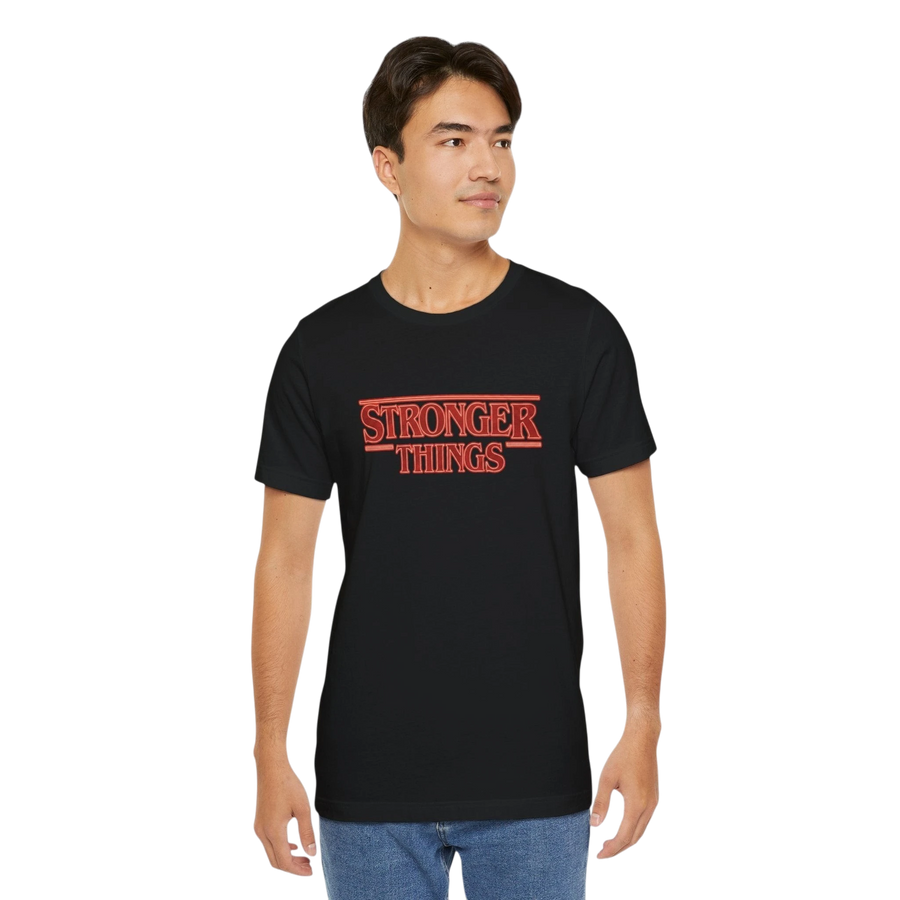 DailyThreadCo. black 100% cotton tee with retro red "STRONGER THINGS" graphic, crew neck, short sleeves.
