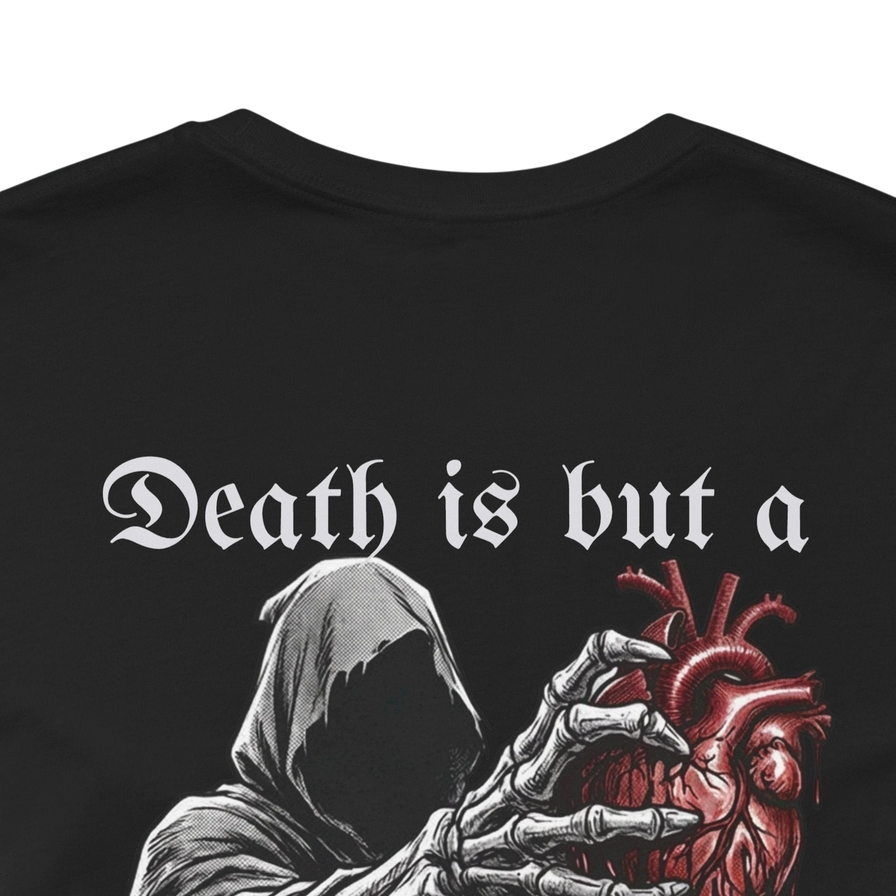 Black 100% cotton t-shirt with a graphic of a grim reaper holding an anatomical heart and the text "Death is but a heartbeat away".