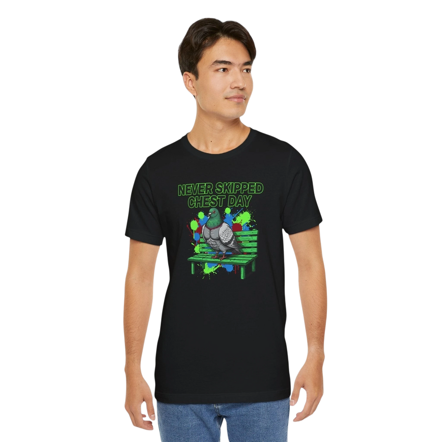 DailyThreadCo. black cotton t-shirt with a graphic of a pigeon on a bench, text reads "NEVER SKIPPED CHEST DAY".