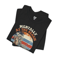 DailyThreadCo black 100% cotton t-shirt with a retro graphic of a skeleton relaxing on a beach chair under palm trees, text reads 