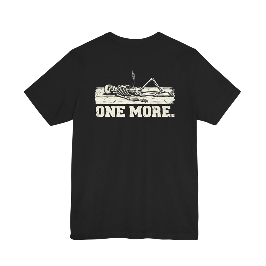DailyThreadCo. black 100% Airlume cotton t-shirt with a graphic of a skeleton reclining on a board with the text "ONE MORE."