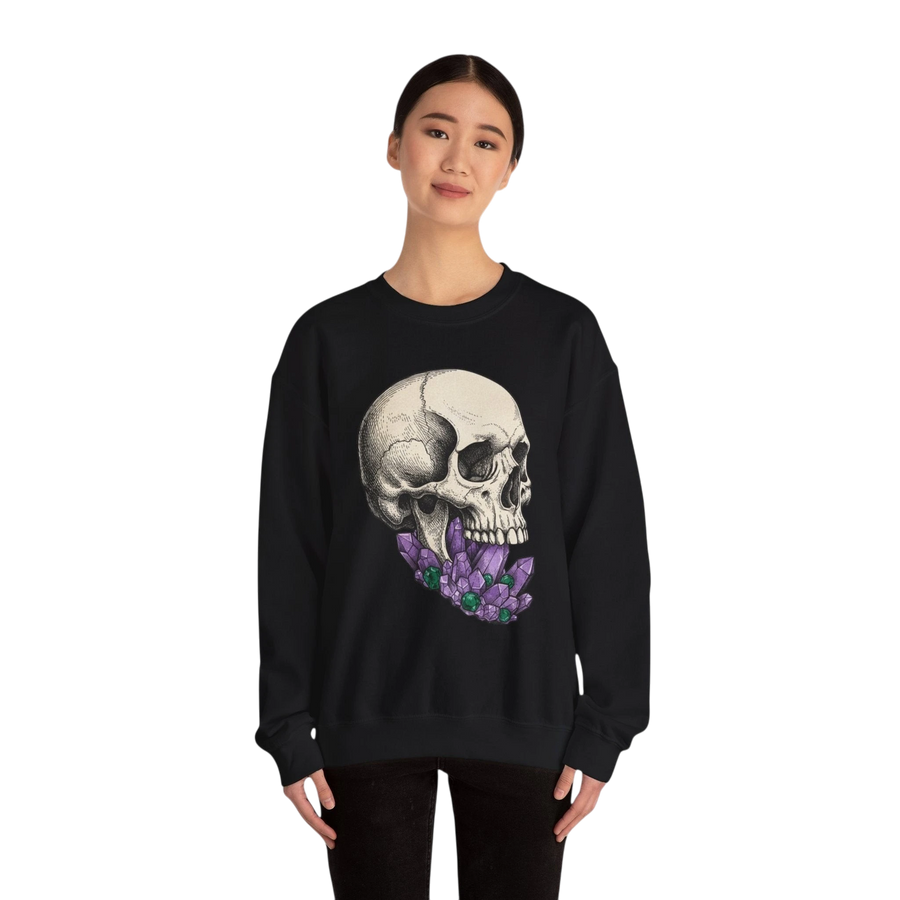 DailyThreadCo. black crewneck sweatshirt with a detailed skull graphic adorned with purple crystals.