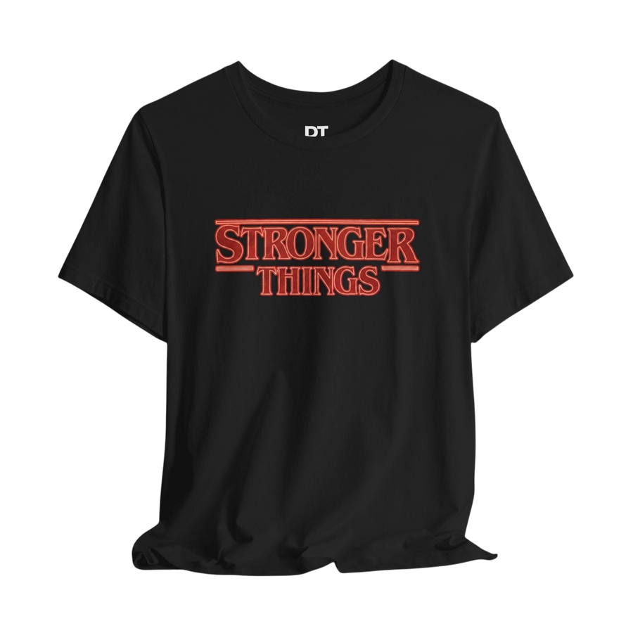 DailyThreadCo. black cotton t-shirt with a retro red graphic that reads "STRONGER THINGS."