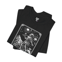 DailyThreadCo. black 100% cotton t-shirt with 'The Fool' tarot card graphic. Features skeleton figure, mountain, sun, and dog.