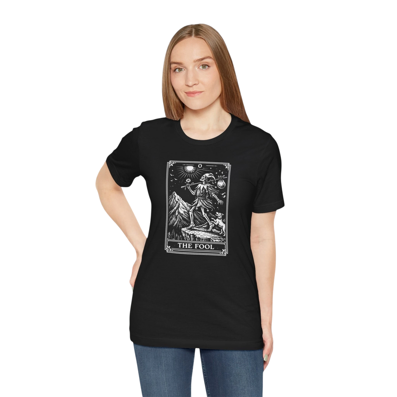 DailyThreadCo. black 100% cotton t-shirt with 'The Fool' tarot card graphic print on front. Features mountain and celestial design.