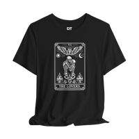 DailyThreadCo. black 100% cotton t-shirt with 'The Lovers' tarot card graphic in white. Features skeleton couple, angel, sun, moon, and flames.