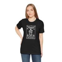 DailyThreadCo. black 100% cotton t-shirt with a monochrome 'The Lovers' tarot card graphic. Features skeleton figures, angelic wings, sun, moon, and flames.