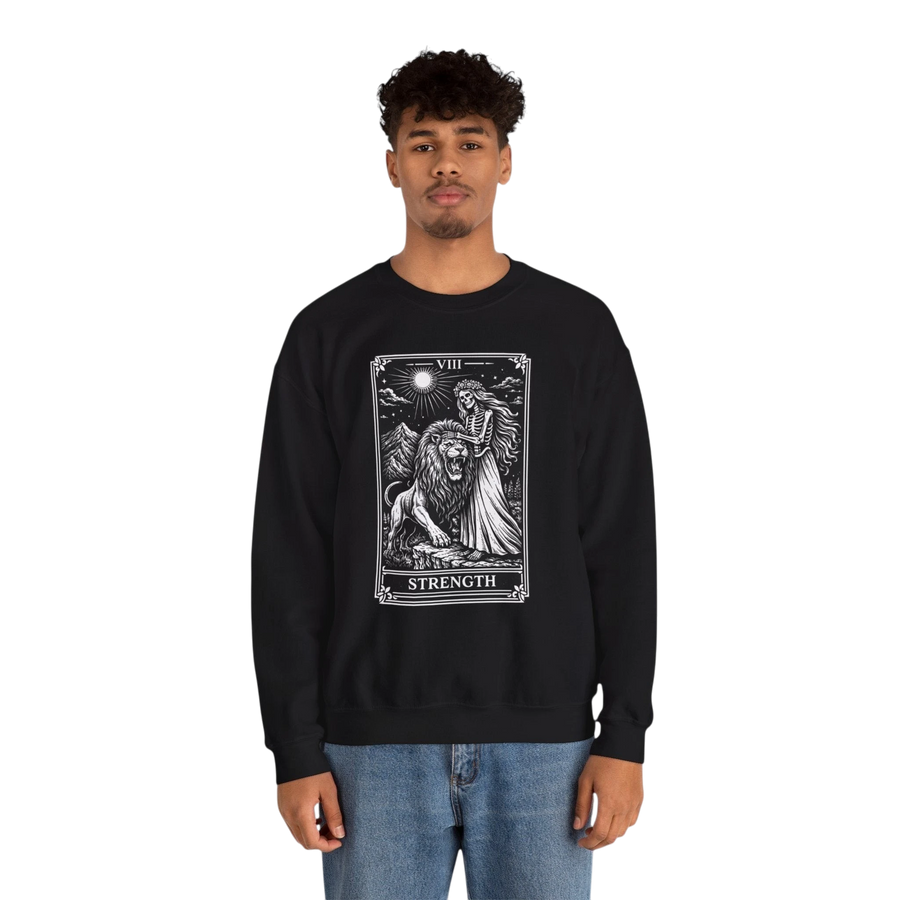DailyThreadCo. black crewneck sweatshirt with a monochrome tarot strength card graphic featuring a woman and a lion.