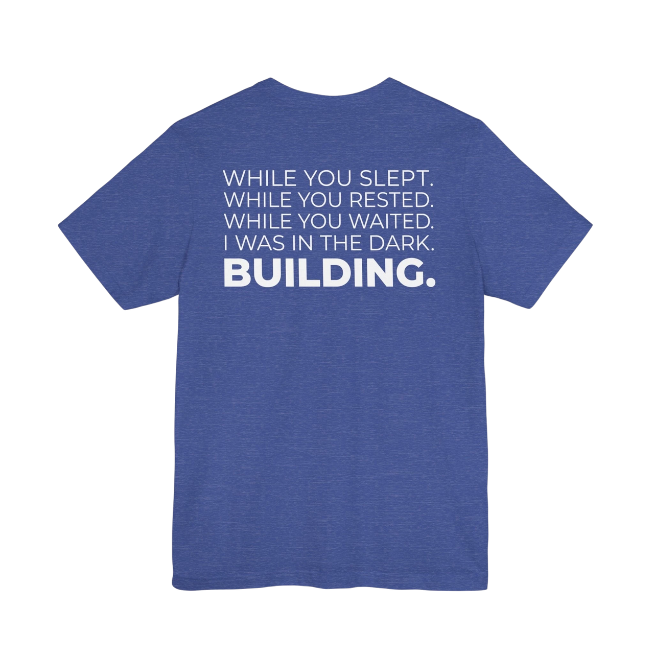 DailyThreadCo. blue cotton t-shirt with white text on back: 'While You Slept. While You Rested. While You Waited. I Was In The Dark. BUILDING.'