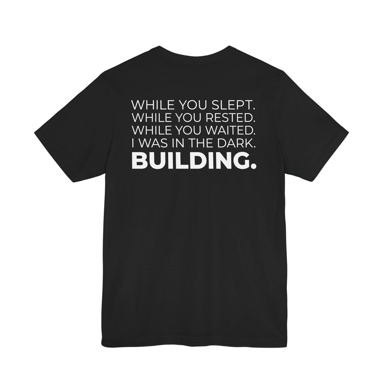 DailyThreadCo. black cotton t-shirt with white text that reads 'WHILE YOU SLEPT. WHILE YOU RESTED. WHILE YOU WAITED. I WAS IN THE DARK. BUILDING.'