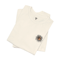 DailyThreadCo. cream 100% cotton tee with a celestial sun and moon graphic on the left chest.