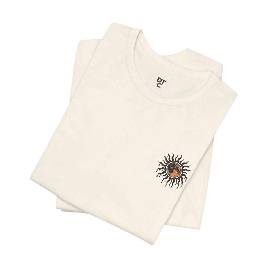 DailyThreadCo. cream 100% cotton tee with a celestial sun and moon graphic on the left chest.