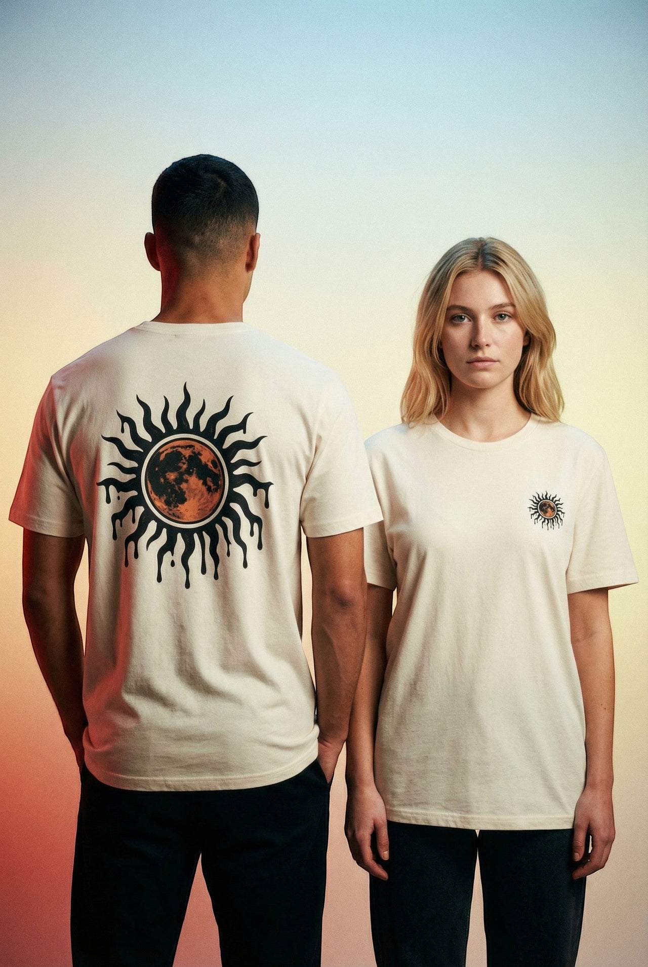 DailyThreadCo. cream cotton t-shirt with a celestial sun and moon graphic on the back and a smaller version on the chest.