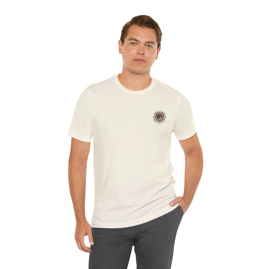 DailyThreadCo. cream 100% cotton t-shirt with a small celestial sun and moon graphic on the left chest.