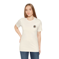 DailyThreadCo. cream 100% cotton short-sleeve tee with a small celestial sun and moon graphic on the left chest.