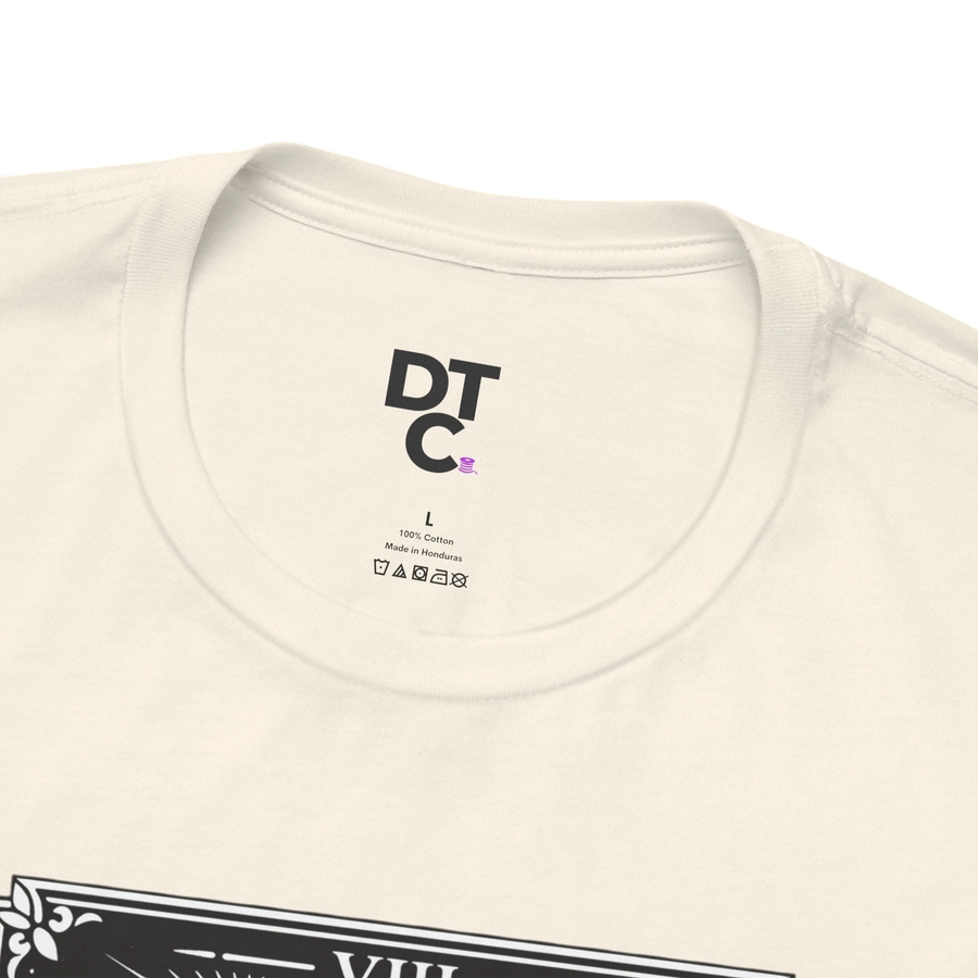 DailyThreadCo. cream 100% cotton crew neck t-shirt with vintage Strength tarot card illustration of woman and lion.