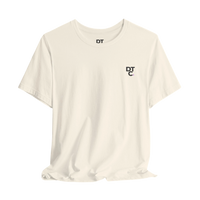 DailyThreadCo. cream cotton t-shirt with a small black DT logo on the left chest and a crew neckline.