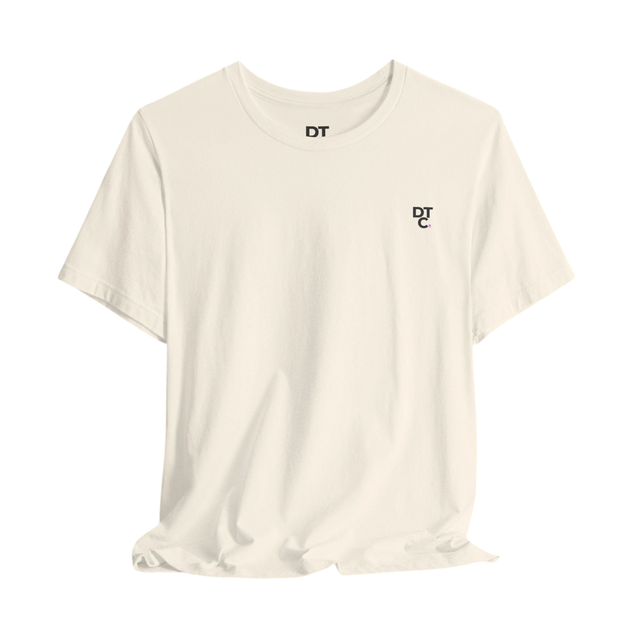 DailyThreadCo. cream 100% cotton t-shirt with a small black DT logo on the left chest.