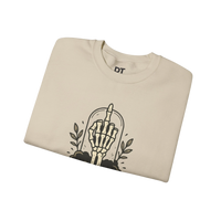 DailyThreadCo. cream crewneck sweatshirt with a skeleton hand graphic giving the middle finger, surrounded by leaves.