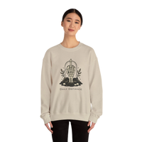 DailyThreadCo. cream crewneck sweatshirt with a skeleton hand graphic giving the middle finger, surrounded by foliage and text Daily Defiance.