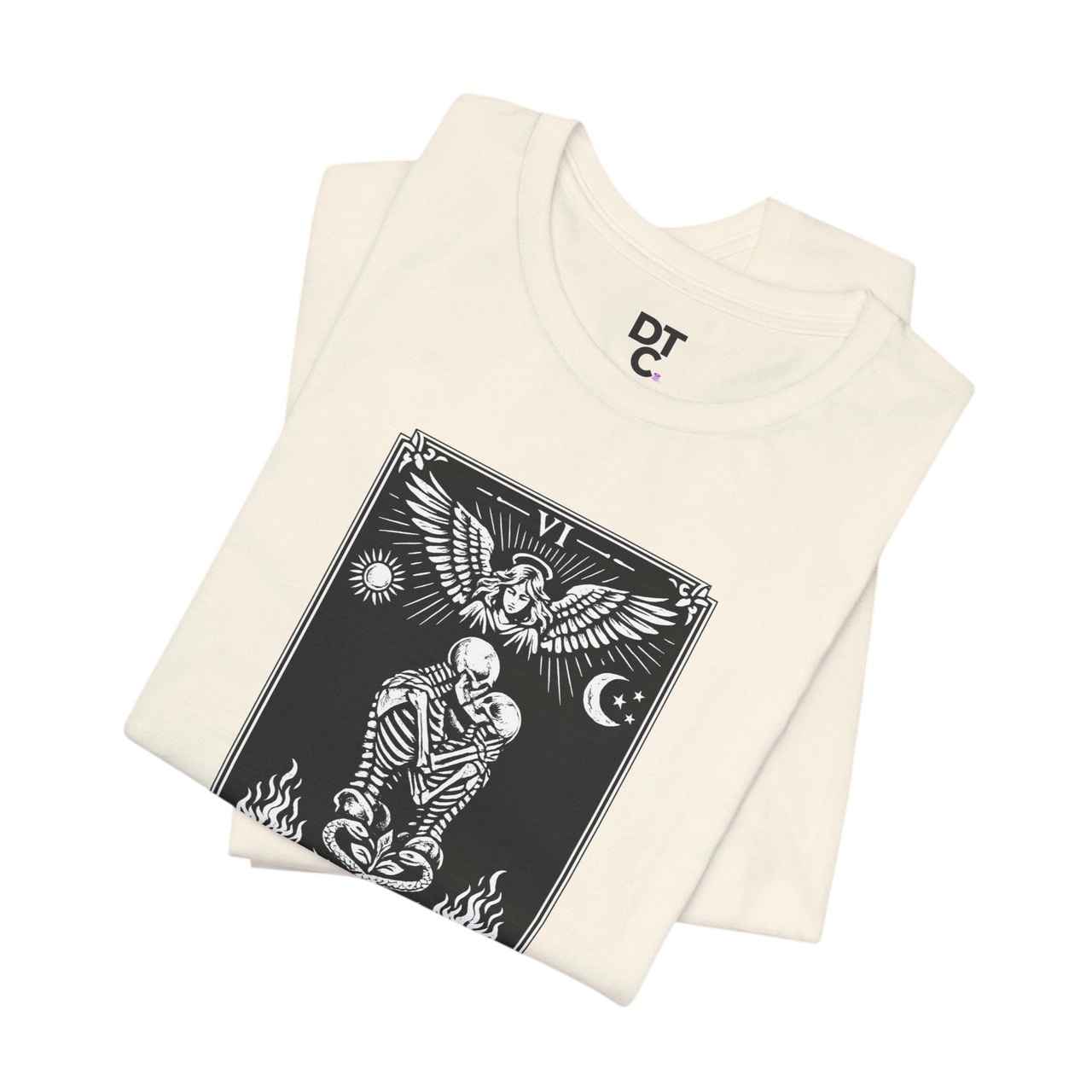 DailyThreadCo. cream 100% cotton t-shirt with black 'The Lovers' tarot card graphic. Features skeletons embracing under an angel.