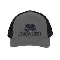 DailyThreadCo. grey trucker cap with black mesh back, featuring a distressed skull graphic and 