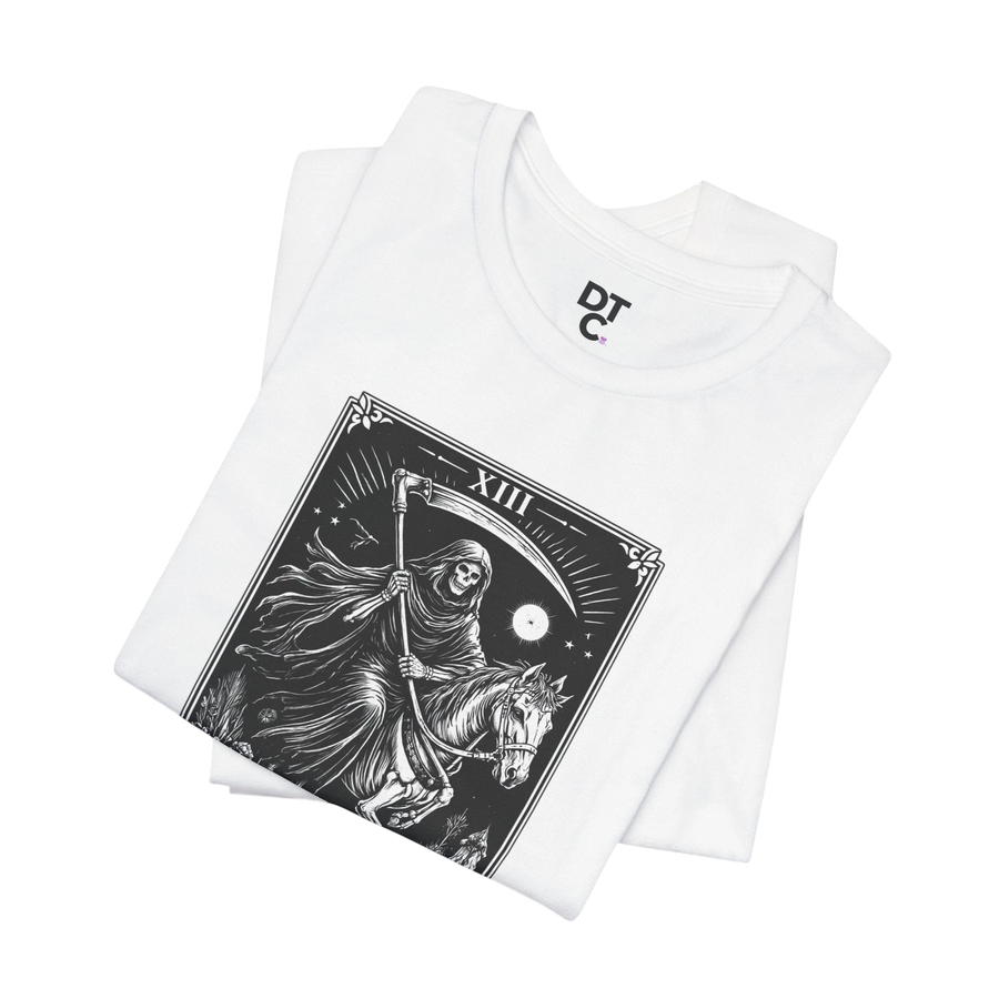 DailyThreadCo. white 100% Airlume cotton t-shirt with a monochrome Death Tarot card graphic featuring a skeleton on horseback and a scythe.