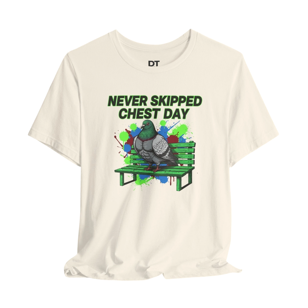 DailyThreadCo. cream cotton t-shirt with a graphic print of a muscular pigeon on a green park bench. Text reads "NEVER SKIPPED CHEST DAY".