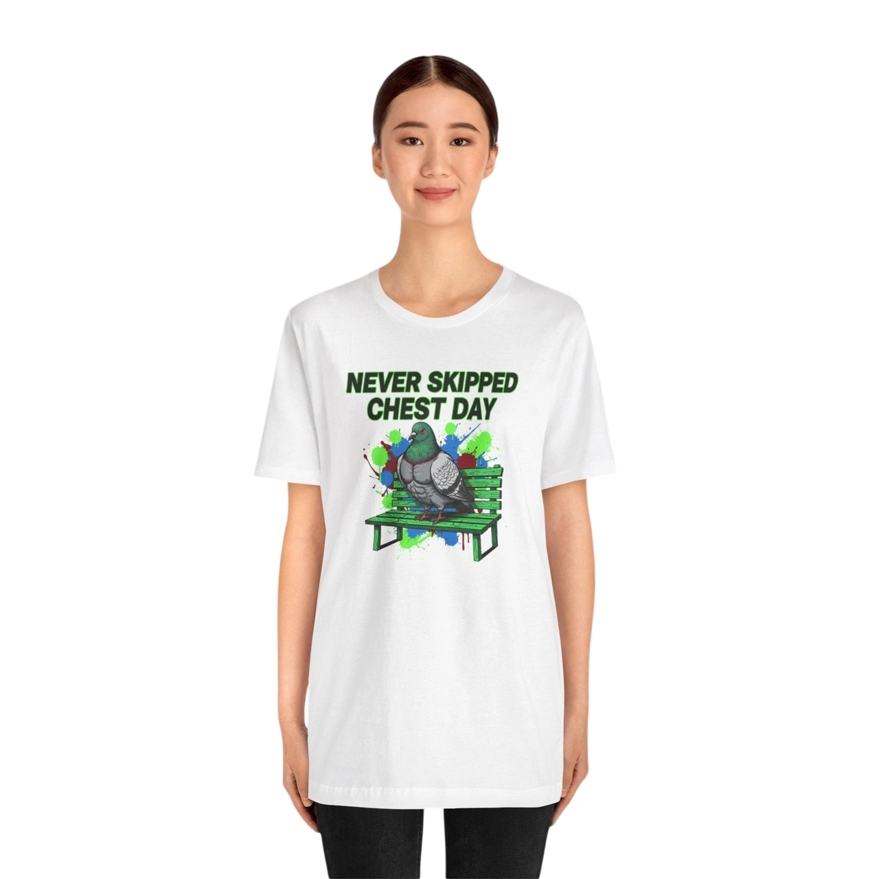 DailyThreadCo. white cotton t-shirt with a graphic of a pigeon on a green bench, text reads "NEVER SKIPPED CHEST DAY".