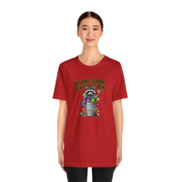 DailyThreadCo. red 100% cotton t-shirt with a graphic of a raccoon in a trash can with the text 