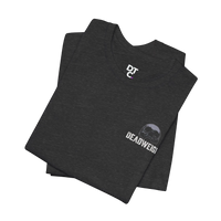 Dark charcoal heather cotton tee with 'DTC' logo on chest and 'DEADWEIGHT' skull graphic on sleeve. DailyThreadCo.