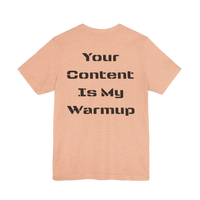 DailyThreadCo. peach cotton graphic tee with black text reading 'Your Content Is My Warmup' on back.