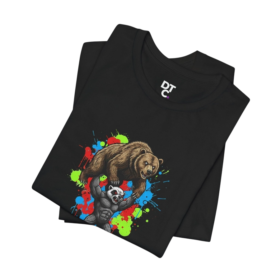 DailyThreadCo black 100% cotton t-shirt with a graphic of a honey badger lifting a bear, set against a colorful paint splash background.