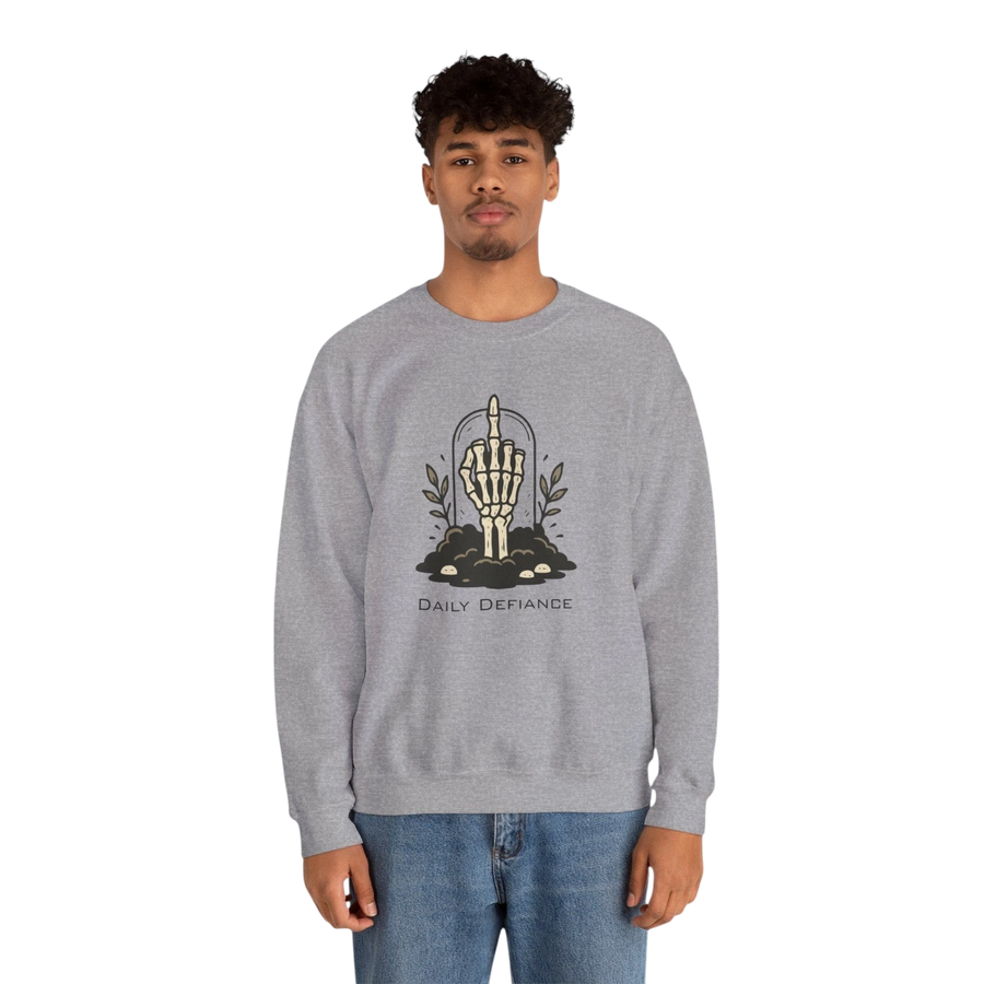 DailyThreadCo. grey crewneck sweatshirt with a skeleton hand graphic giving the middle finger, surrounded by foliage and the words "Daily Defiance".