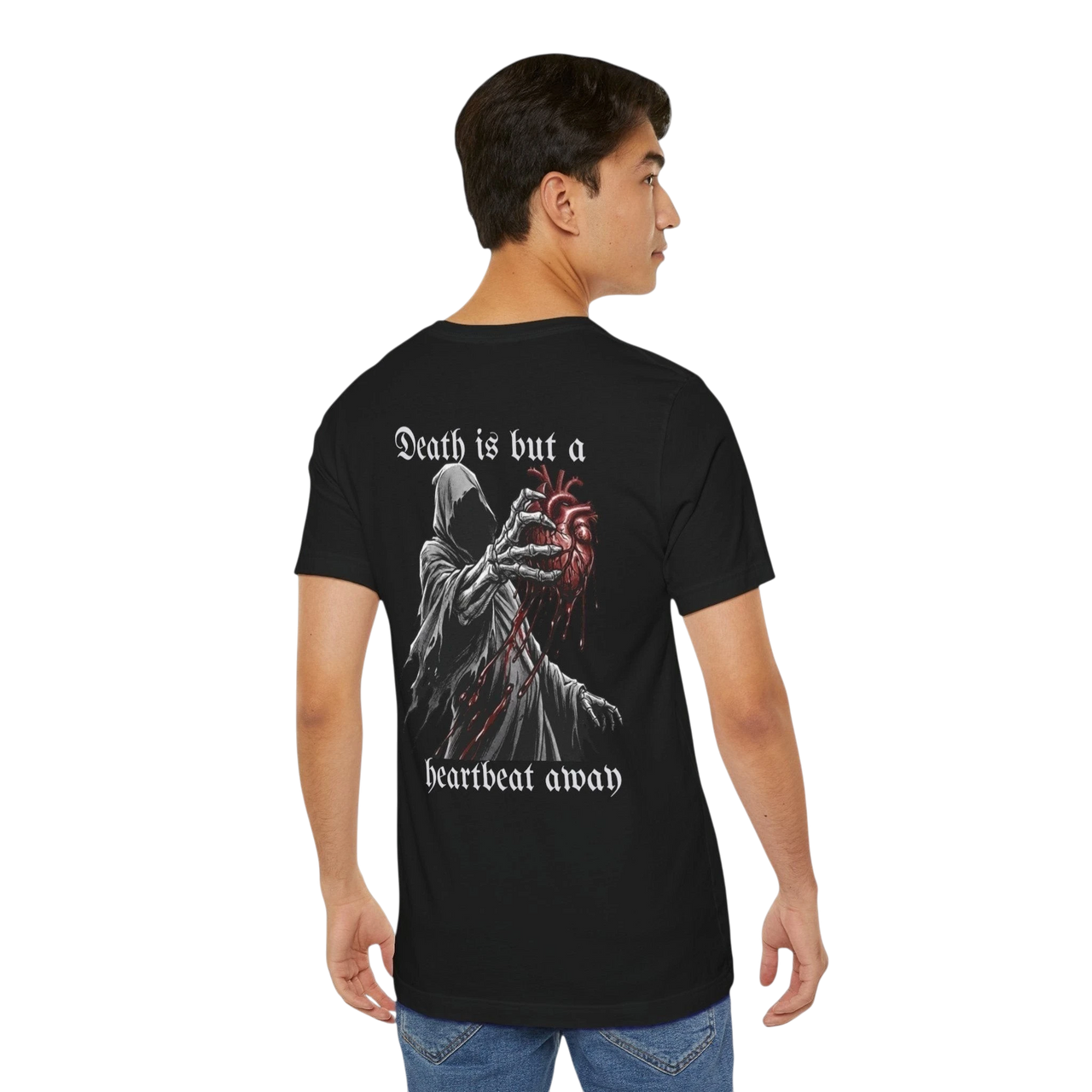 DailyThreadCo. black 100% cotton t-shirt with a graphic of the Grim Reaper holding a bloody anatomical heart and the text "Death is but a heartbeat away".