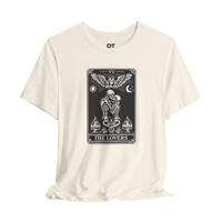 DailyThreadCo. cream cotton t-shirt with black 'The Lovers' tarot card graphic. Features skeleton couple, angel, sun, moon, and flames.